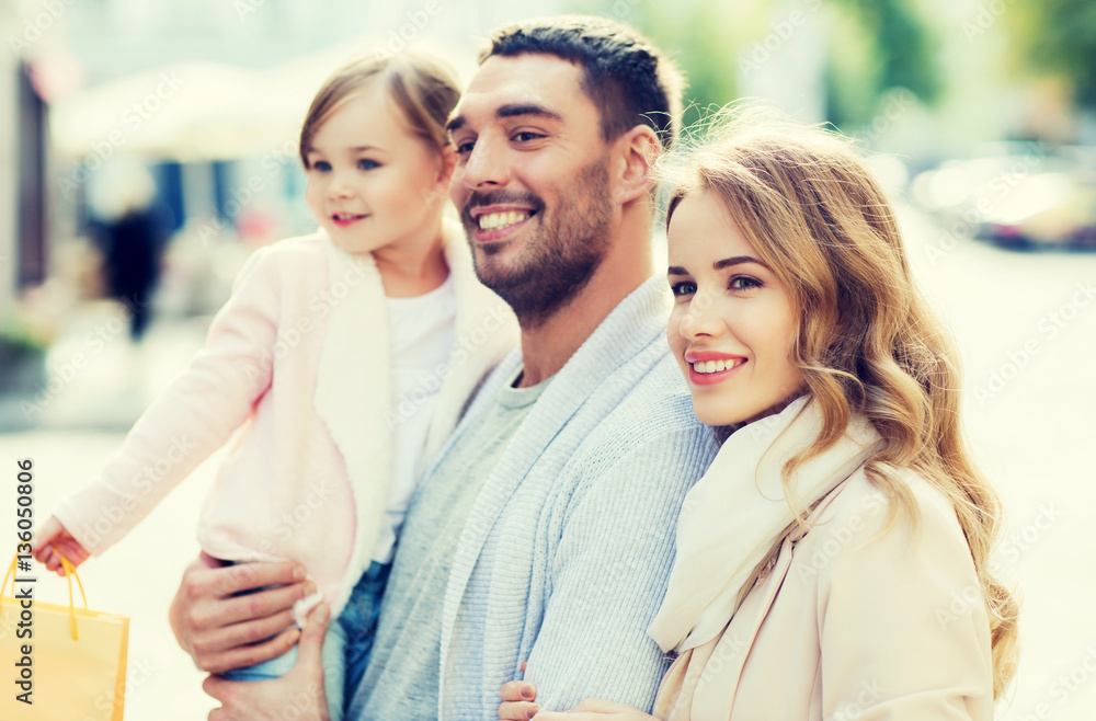 happy family with child and shopping bags in city happy family with child and shopping bags in city