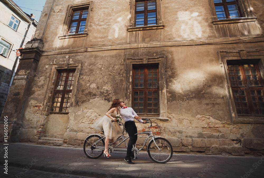 The couple in love rides by bicycle The couple in love rides by bicycle