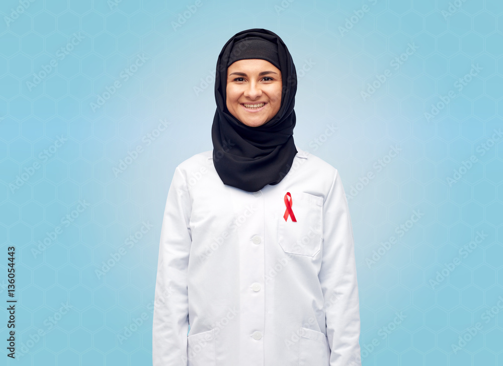 muslim doctor in hijab with red awareness ribbon
