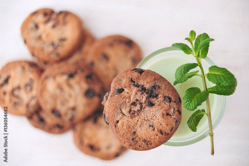 Milk cocktail on a rustic table with cookies Milk cocktail on a rustic table with cookies