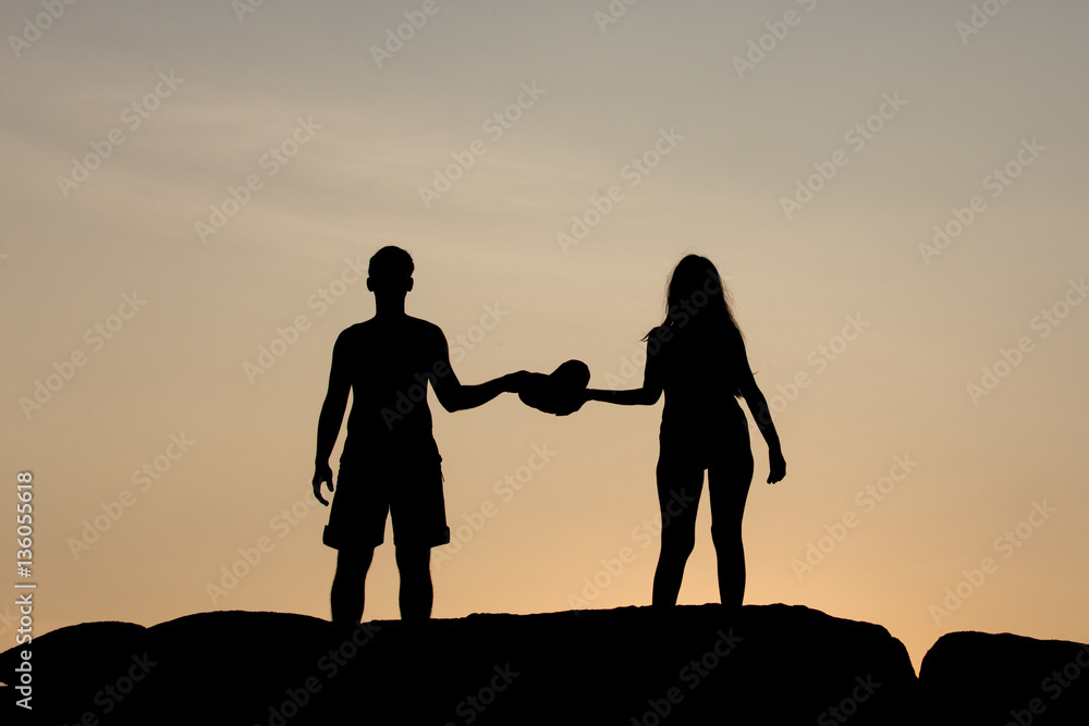 silhouette of couple at sunset summer, healthy concept.