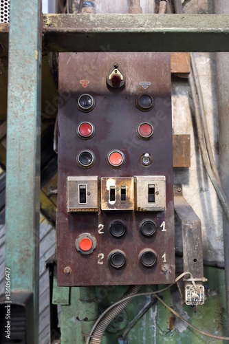 Industrial control panel in a retro style with buttons and toggle switch