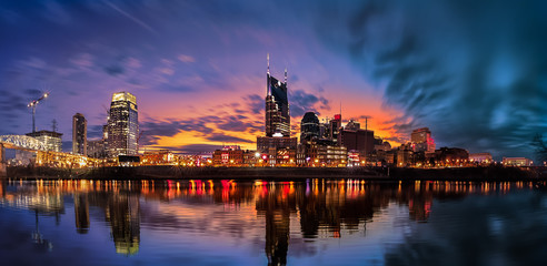 Nashville skyline with blue clouds and orange background