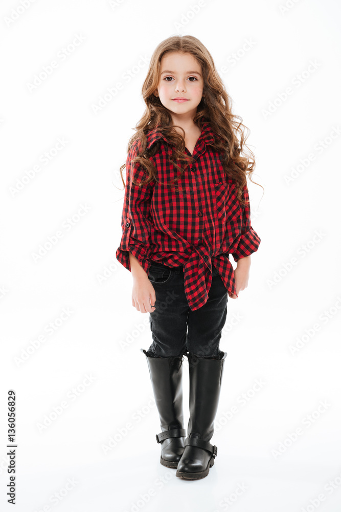 Full length of smiling little girl in plaid shirt walking Full length of smiling little girl in plaid shirt walking