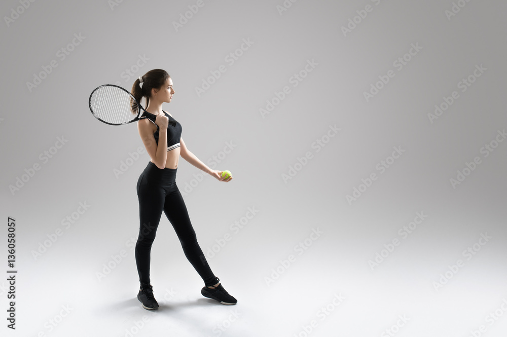 Studio portrait of beautiful girl tennis player with a racket. Studio portrait of beautiful girl tennis player with a racket.