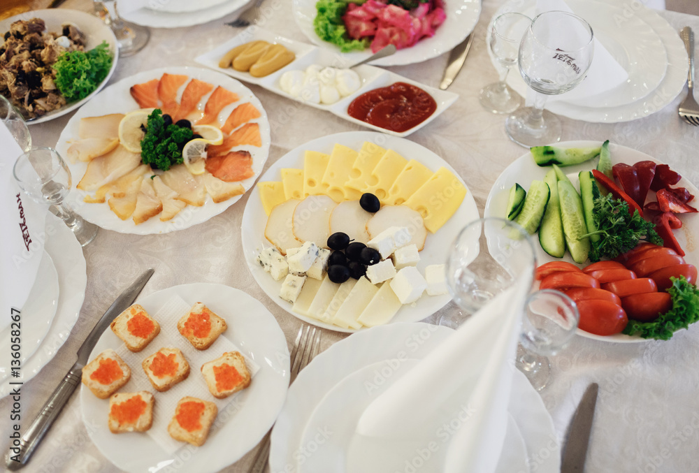 The dishes on the wedding table in restaurant The dishes on the wedding table in restaurant