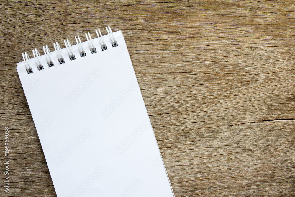 Blank note paper on brown wooden background Blank note paper on brown wooden background