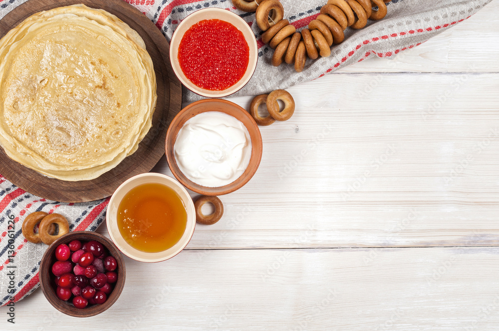 Russian pancake blini on white wooden background Russian pancake blini on white wooden background