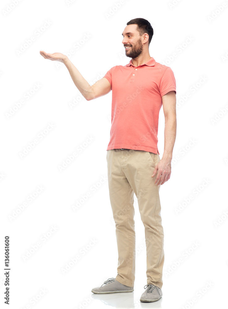 happy man holding something imaginary on hand happy man holding something imaginary on hand