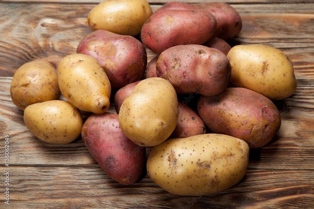 Potatoes on a rustic background Potatoes on a rustic background