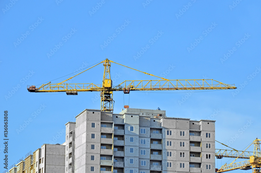 Crane and highrise construction site Crane and highrise construction site