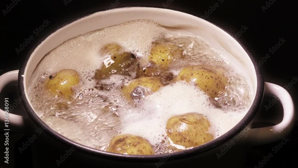 Potatoes boiling in a pan Potatoes boiling in a pan