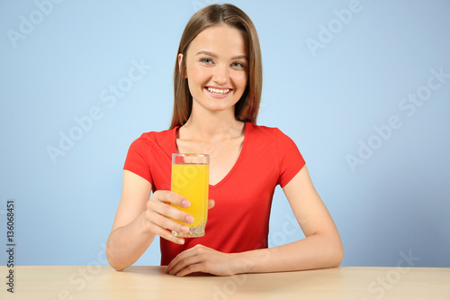 Young woman with glass of f...