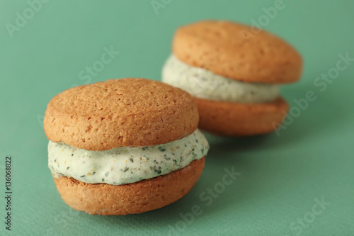Ice cream cookie sandwiches on green background