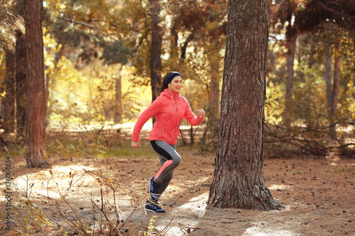Sporty young woman running ...