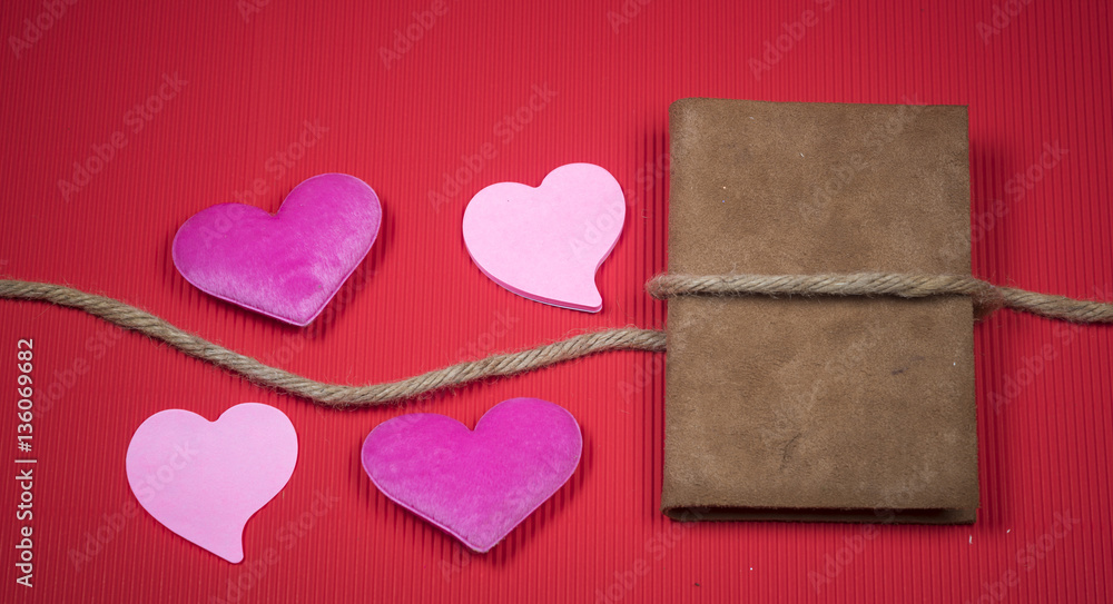 Valentine background with sewed pillow hearts row border on red clothespins. Happy lovers day card mockup, copy space