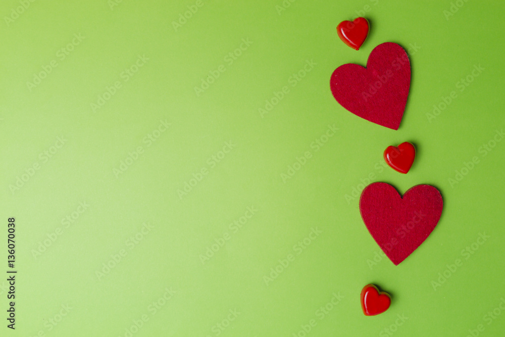 Red hearts greenery valentines day background. Minimal style. Flat lay. Top view. Copy space