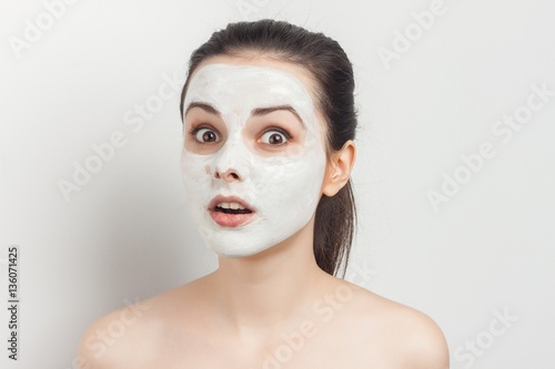 white mask and surprised woman