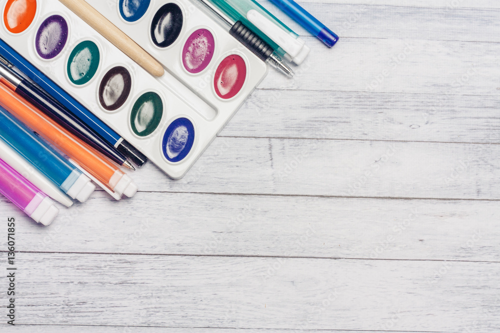 Fototapeta premium Multicolored markers and dots near watercolor paints