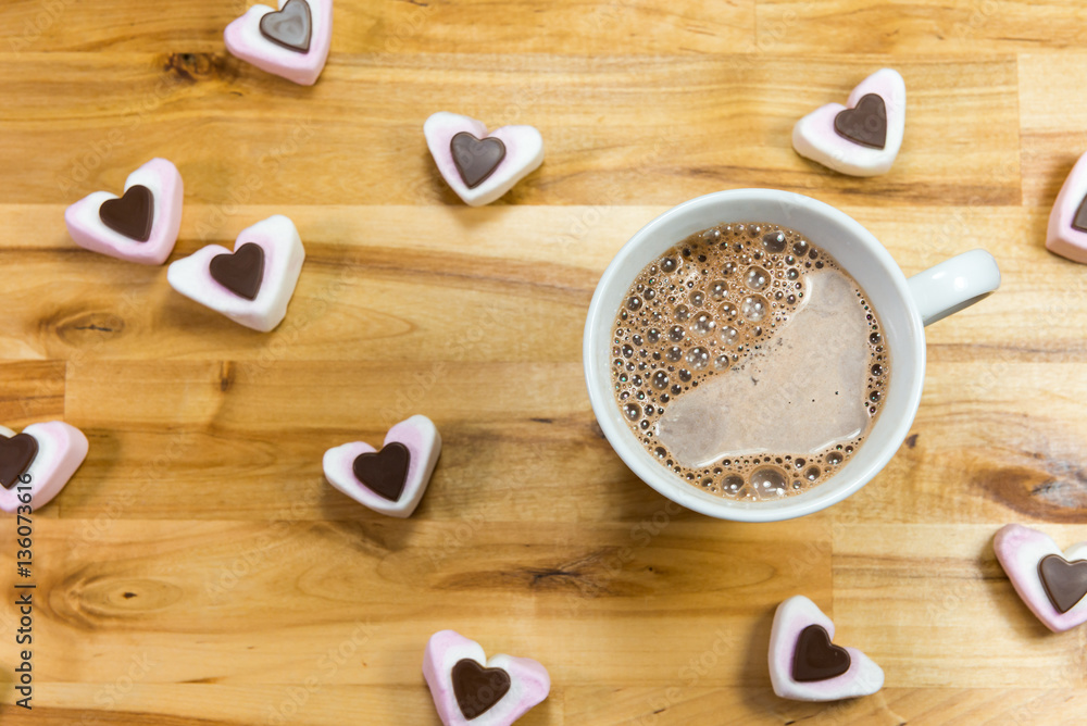 Overhead view of drinking chocolate and heart shaped sweets. Overhead view of drinking chocolate and heart shaped sweets.