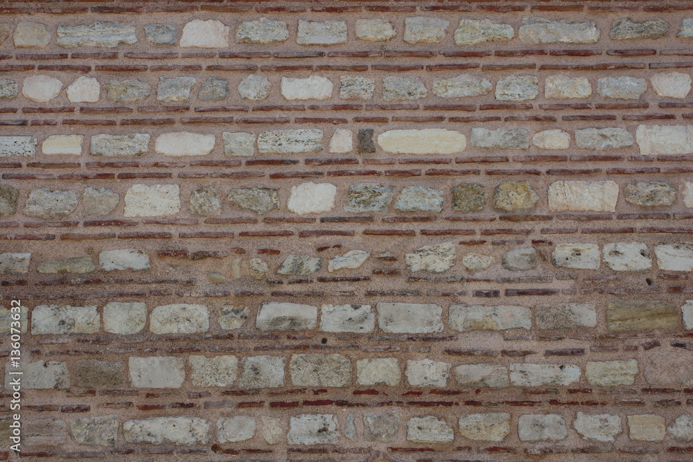 Old stone wall with brick texture background.