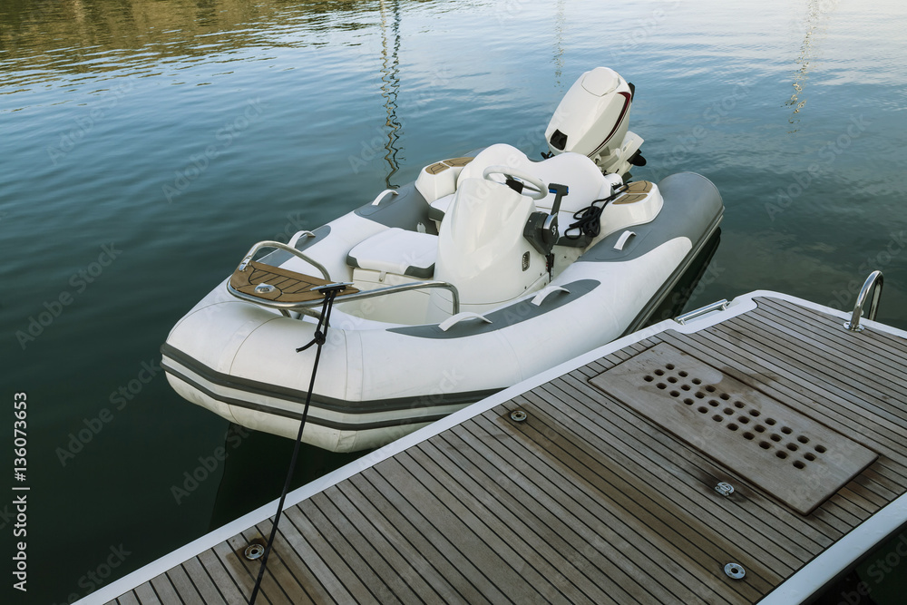 Φωτογραφία Luxury white inflatable motorboat in the sea connected to yacht, Croatia