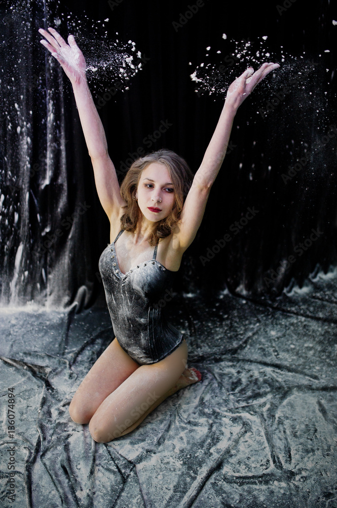 Girl dancer jumping and dancing in the white dust with flour on Girl dancer jumping and dancing in the white dust with flour on