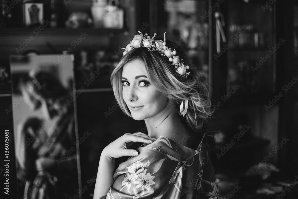 beautiful bride standing at the dress and mirror. morning bride. beautiful bride standing at the dress and mirror. morning bride.