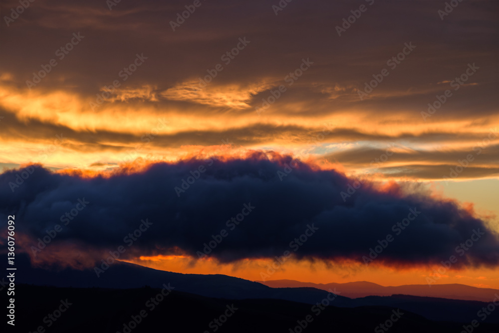 Layers of clouds, dyed in different shades