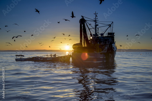 Sonnenaufgang  in der Adria. Fiescherboot. photo