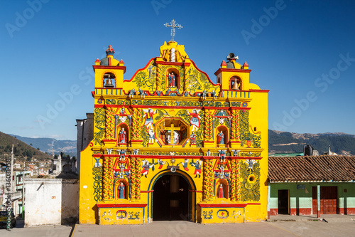 Church facade in San Andres Xecul town, Guatemala photo