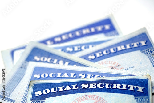 Bild auf Leinwand Social Security Cards in a Row Pile for Retirement