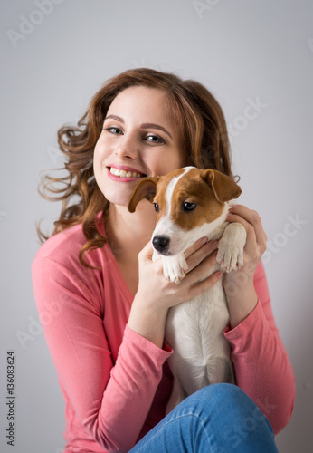 young woman with a puppy Jack Russell