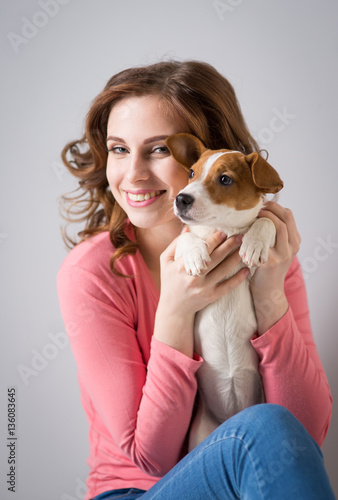 young woman with a puppy Jack Russell