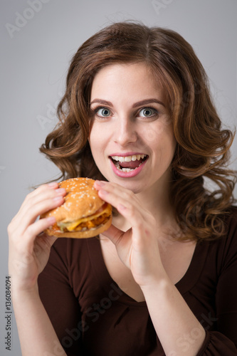 Young woman with hamburger