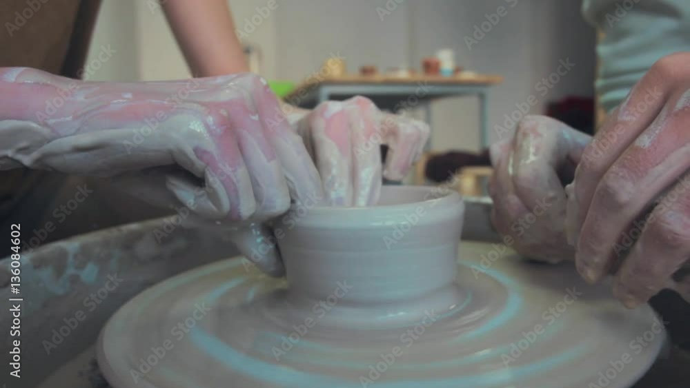 Potter Works On His Craft On A Spinning Pottery Wheel Potter Works On His Craft On A Spinning Pottery Wheel