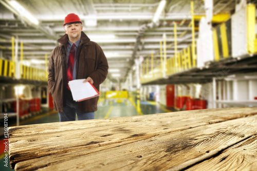 worker and wooden desk 