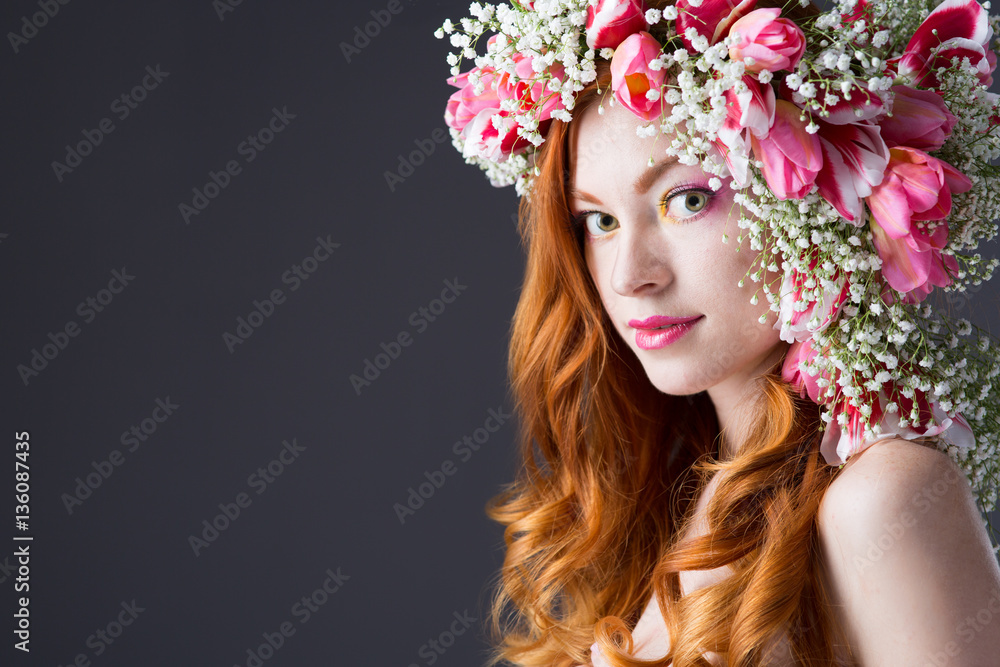 young woman in a wreath of tulips
