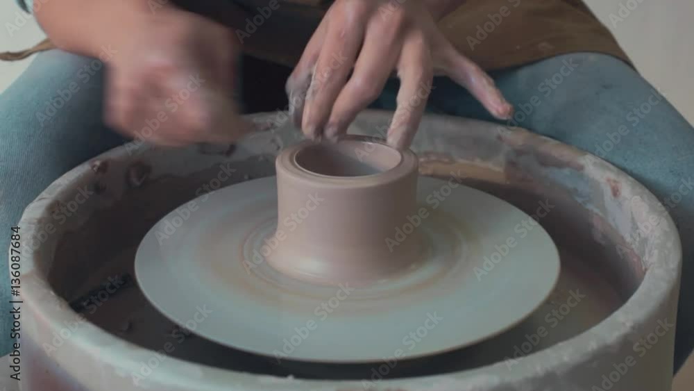 Potter Works On His Craft On A Spinning Pottery Wheel Potter Works On His Craft On A Spinning Pottery Wheel