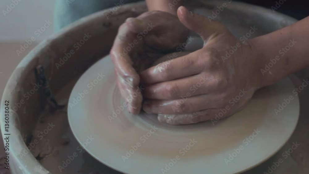Potter Works On His Craft On A Spinning Pottery Wheel Potter Works On His Craft On A Spinning Pottery Wheel