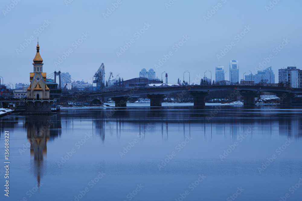 Church of St. Nicholas the Wonderworker in the waters and Harbor bridge. Morning city. Winter landscape. Kyiv. Ukraine 