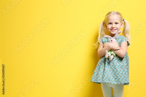Cute little girl with bunny...