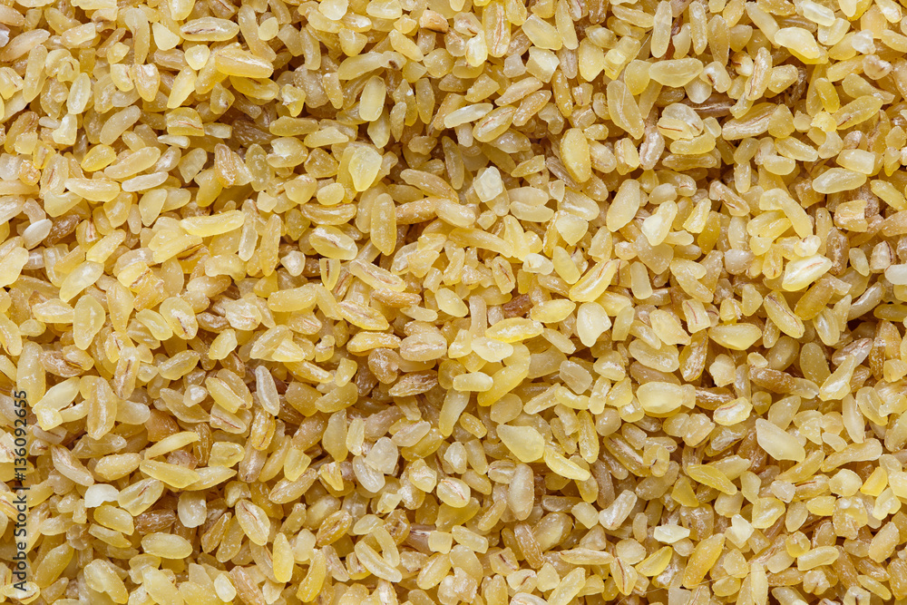 Background of dry bulgur wheat from above.