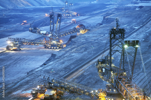 Large bucket wheel excavators in a lignite (brown-coal) mine after sunset, Germany