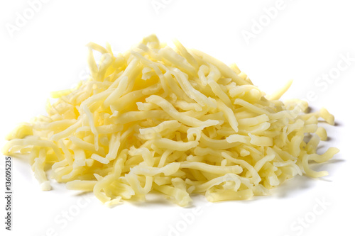 Close up of heap of grated mix Italian cheese on white backgroun