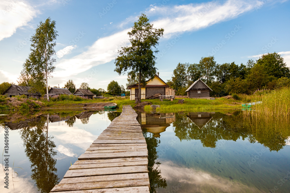 Traditional russian wooden baths at the bank of lake in summer d Traditional russian wooden baths at the bank of lake in summer d
