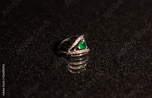 silver ring with a green stone