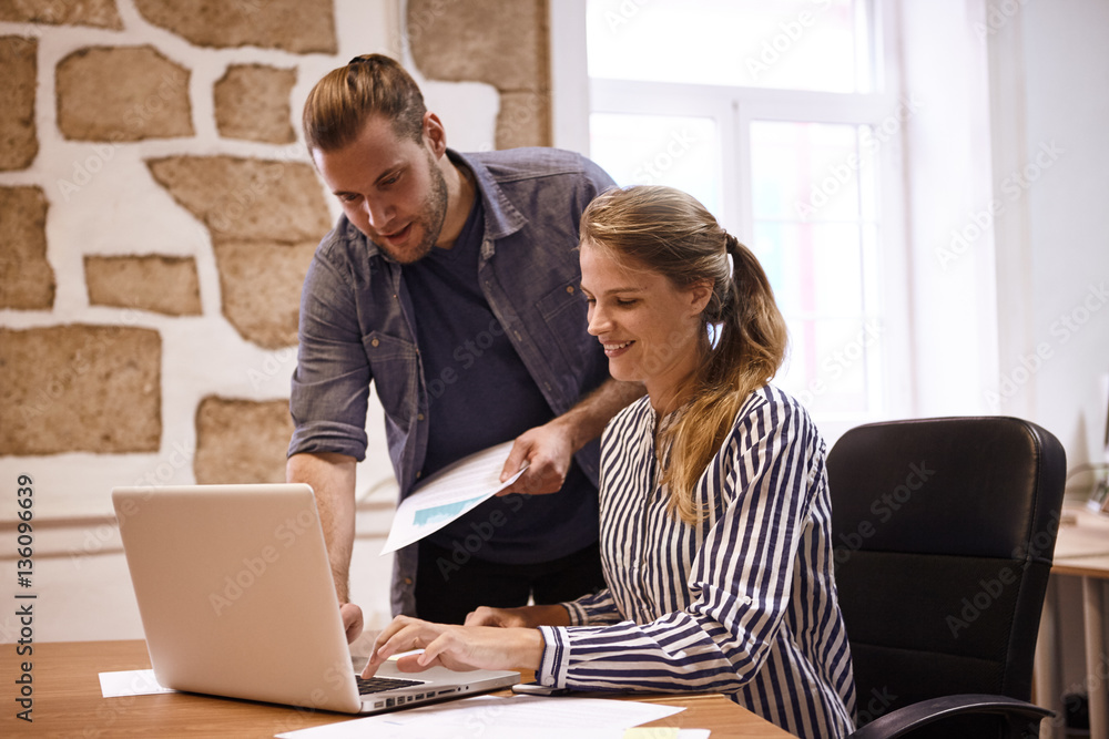 Two young business professionals in meeting Two young business professionals in meeting