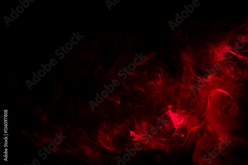 red smoke on black background photo
