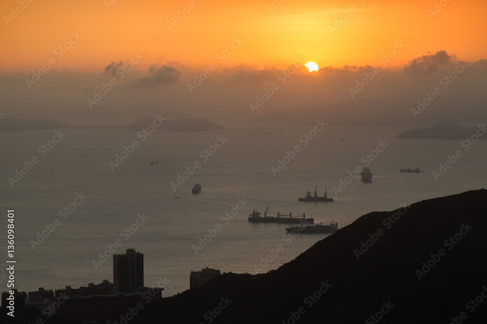 Naklejka premium Ocean, islands, ships, coastline and sunset in Hong Kong, China, viewed from the Victoria Peak.